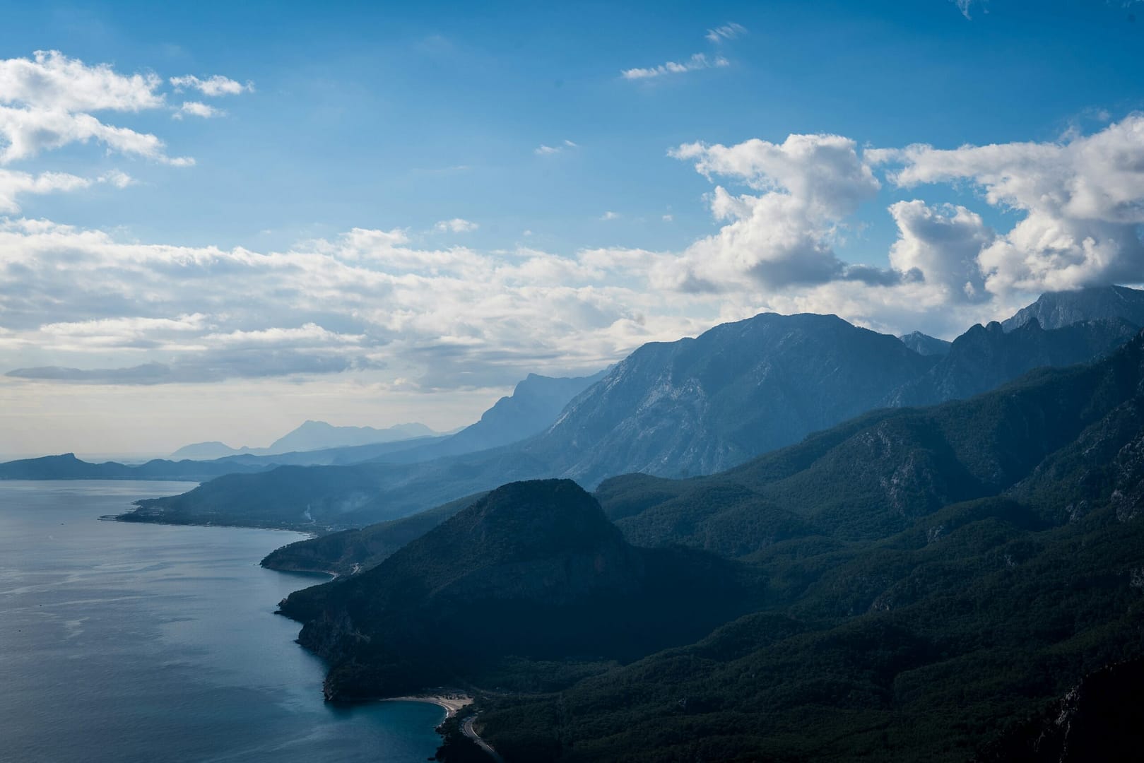 a scenic view of mountains and a body of water