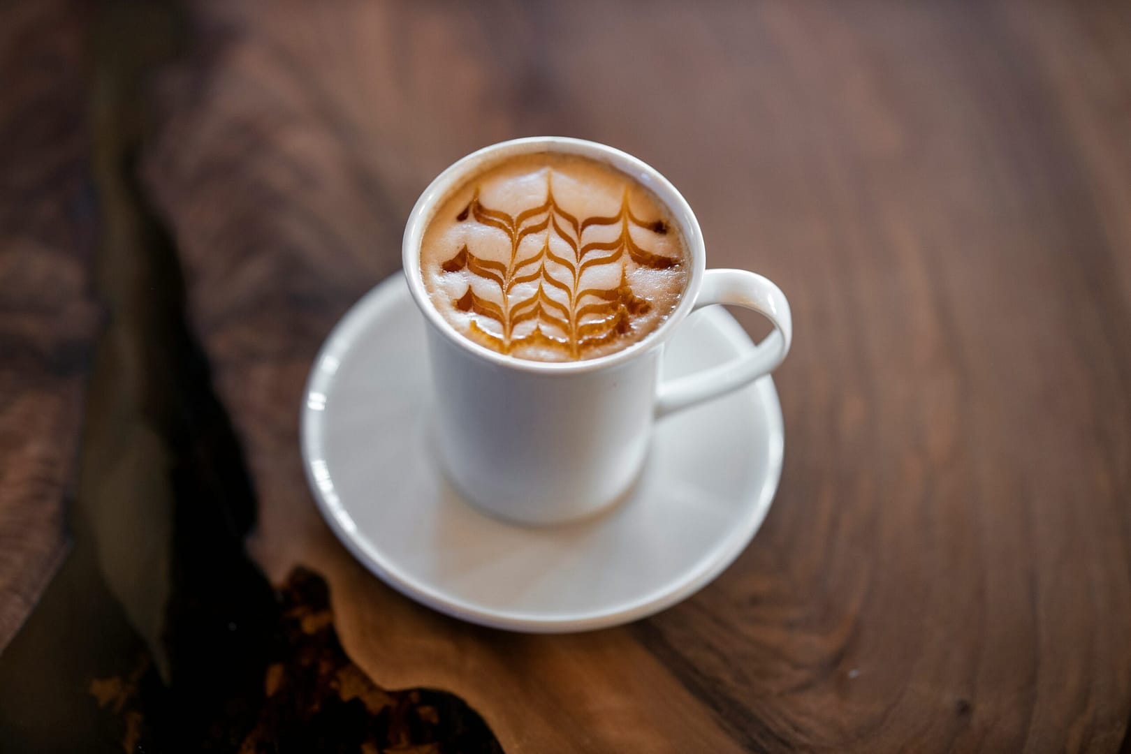 white ceramic mug on white ceramic saucer