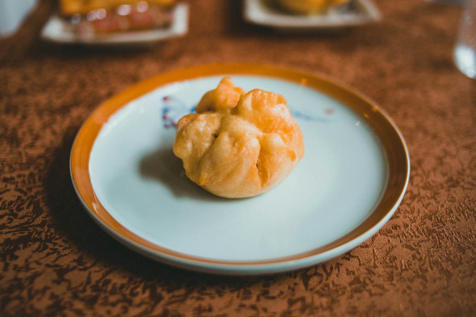 brown pastry on white ceramic round plate
